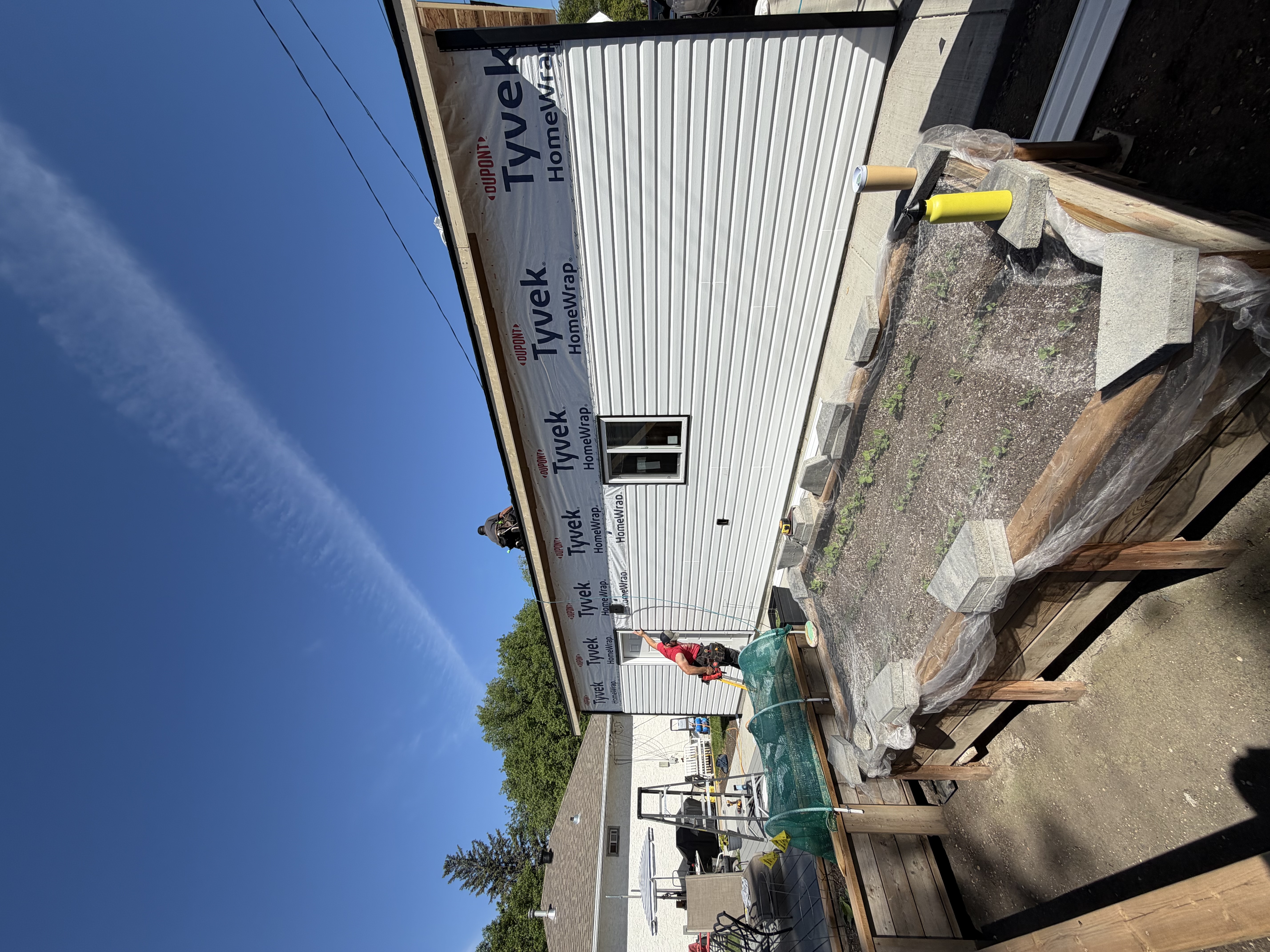 WLG Homes crew installing siding on a Saskatoon garage build